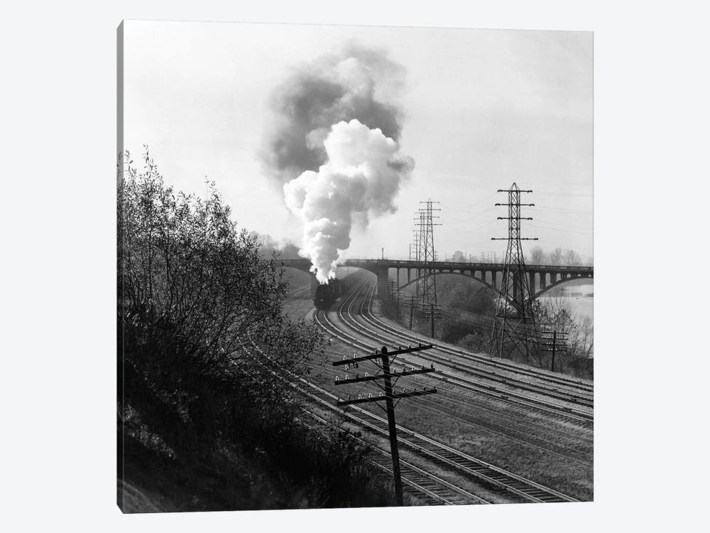 1940s Aerial Of Train Traveling Along River Under Bridge Billowing Smoke Near Columbus Ohio by Vintage Images 1-piece Canvas Artwork