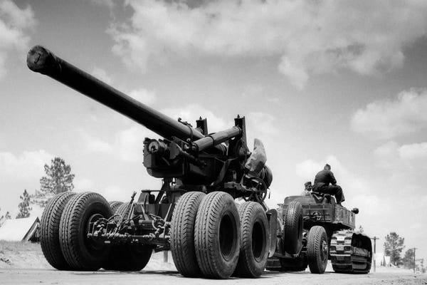 Military Vehicles: 1940s Army Track Laying Vehicle Caterpillar Tractor Hauling Heavy World War Ii Artillery Cannon by Vintage Images