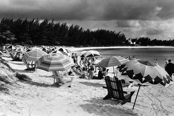 Bahamas: 1940s Beach Umbrellas Chairs On Sand Paradise Beach Nassau West Indies by Vintage Images