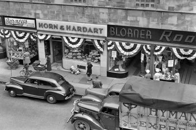 1940s Store Fronts Decorated With Parade Bunting Main Street 82Nd Street Jackson Heights Queens New York City USA by Vintage Images art print