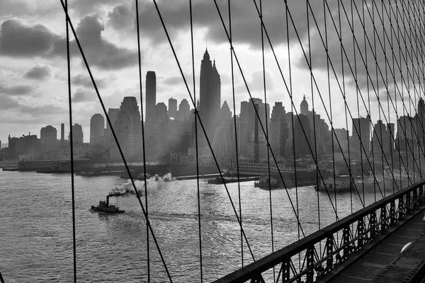 Brooklyn: 1940s-1950s Downtown Skyline Manhattan Seen Through Cables Of Brooklyn Bridge Tug Boat In East River NYC NY USA by Vintage Images