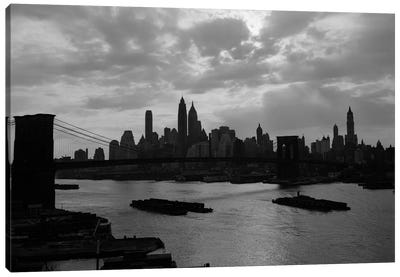 1940s-1950s Dramatic Sunset Downtown New York City Skyline With Brooklyn Bridge Barges In East River NYC NY USA Canvas Art Print - Brooklyn Bridge