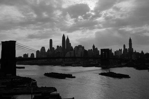 1940s-1950s Dramatic Sunset Downtown New York City Skyline With Brooklyn Bridge Barges In East River NYC NY USA