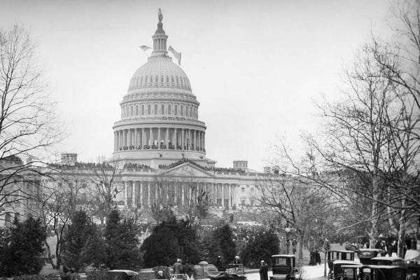 Washington, D.C.: 1910s-1920s Capitol Building Washington, D.C. Line Of Cars Parked On Street In Foreground by Vintage Images