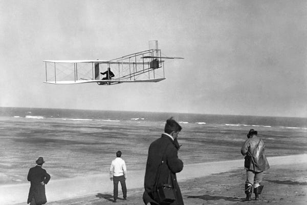 North Carolina: 1911 One Of The Wright Brothers Flying A Glider And Spectators On Ocean Beach Kill Devil Hills Kitty Hawk North Carolina USA by Vintage Images