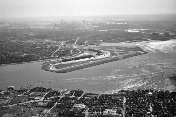 Airports: 1950s Aerial Across Flushing Bay La Guardia Airport College Point Queens Manhattan Skyline In Distance Looking West by Vintage Images