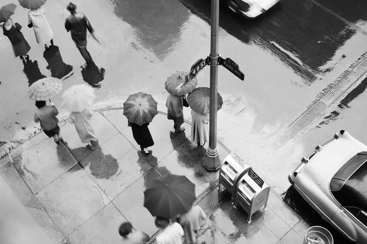 1950s Aerial Of Street Corner In The Rain Pedestrians With Umbrellas Cars Wet Pavement Park Ave & 48th Street New York City USA