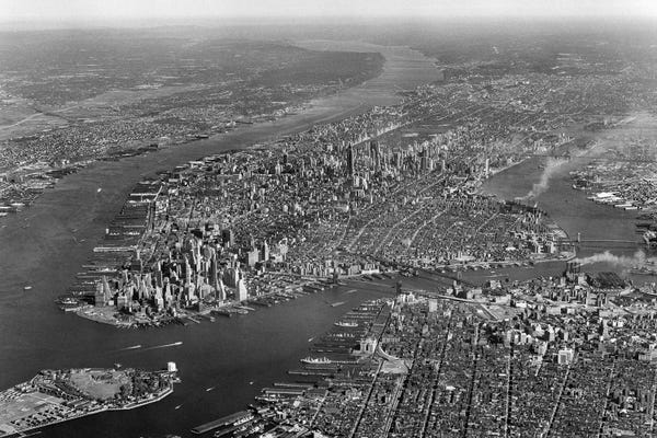 Brooklyn: 1950s Aerial View Of Manhattan Island On Left Is Hudson River On Right Is East River And Brooklyn Lower Left Is Governors Island by Vintage Images