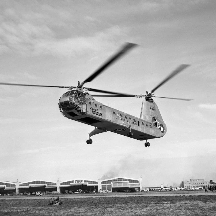 1950s Air Force Twin-Rotor Piasecki Helicopter Taking Off From Base