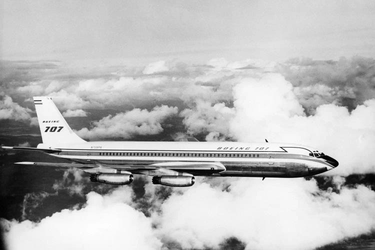 1950s Boeing 707 Passenger Jet Flying Through Clouds