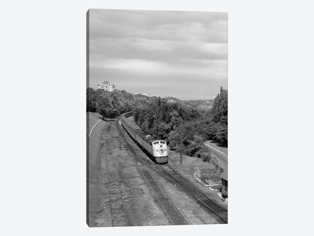 1950s Overhead View Of Streamlined Front Cab Diesel Locomotive Passenger Railroad Train Passing Through Suburban Area by Vintage Images 1-piece Canvas Art