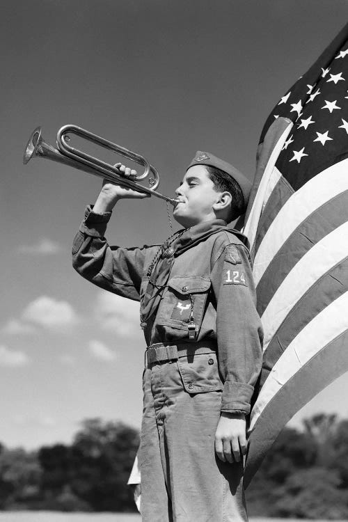 1950s Profile Of Boy Scout In Uniform Standing In Front Of 48 Star American Flag Blowing Bugle