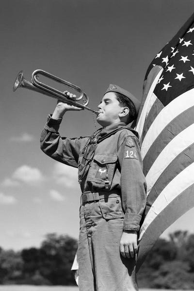 1950s Profile Of Boy Scout In Uniform Standing In Front Of 48 Star American Flag Blowing Bugle