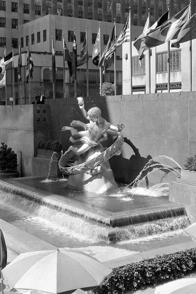 Fountains: 1950s Rockefeller Center Prometheus Fountain By Paul Manship And United Nations Flags New York City NY USA by Vintage Images
