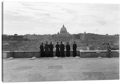 1950s Rome Italy Back View Of Student Priests Lined Up By Wall Overlooking City With View Of St. Peters Basilica In Background Canvas Art Print - Vintage Images