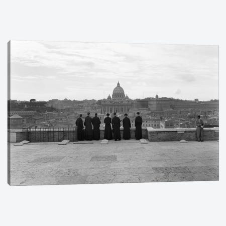 1950s Rome Italy Back View Of Student Priests Lined Up By Wall Overlooking City With View Of St. Peters Basilica In Background Canvas Print #VTG337} by Vintage Images Canvas Art Print