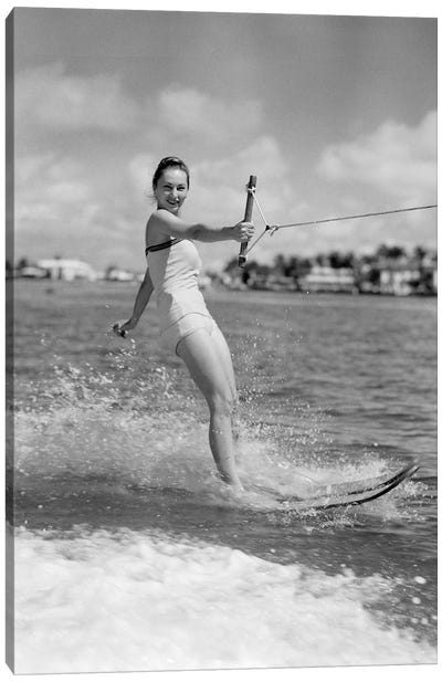 1950s Smiling Woman In Bathing Suit Water Skiing Waving One Hand Looking At Camera Canvas Art Print - Women's Swimsuit & Bikini Art