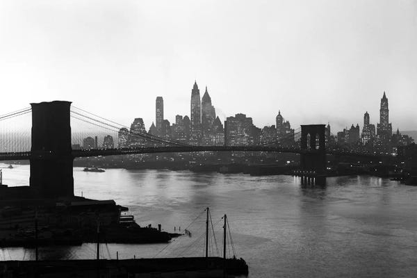 Famous Bridges: 1950s Twilight Skyline Of Lower Manhattan Brooklyn Bridge In Foreground New York USA by Vintage Images