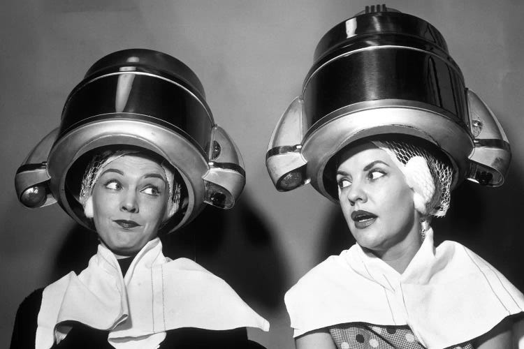 1950s Two Women Sitting Together Gossiping Under Hairdresser Hair Dryer