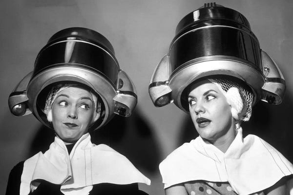 Vintage & Retro Photography: 1950s Two Women Sitting Together Gossiping Under Hairdresser Hair Dryer by Vintage Images