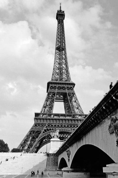Paris Photography: 1920s Eiffel Tower With People Walking Up Stairs & Standing On Bridge In Foreground by Vintage Images