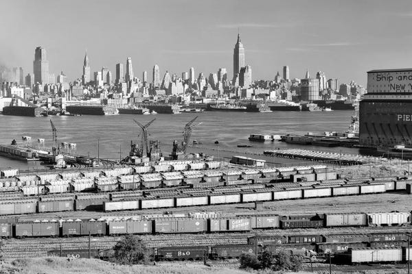 New Jersey: 1950s-1960s Skyline Midtown Manhattan From Across The Hudson River Railroad Tracks Foreground In West New York NJ USA by Vintage Images