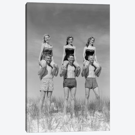 1950s-1960s Three Couples At Beach On Dunes With Women In Identical Bathing Suits Sitting On Men's Shoulders Canvas Print #VTG386} by Vintage Images Canvas Art