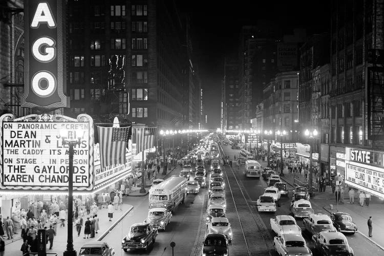 1953 Night Scene Of Chicago State Street With Traffic And Movie Marquee With Pedestrians On The Sidewalks