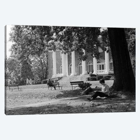 1960s Anonymous Silhouetted Female College Student Sitting Under Tree Studying With Campus Building In Background Canvas Print #VTG400} by Vintage Images Canvas Art