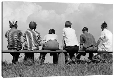 1960s Back View Of Six Anonymous Boy Baseball Players Sitting On Bench Canvas Art Print - Vintage Images