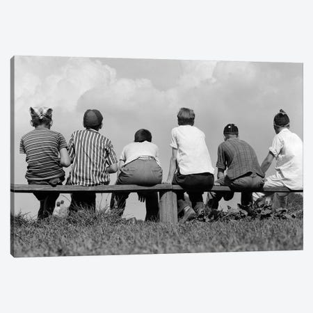 1960s Back View Of Six Anonymous Boy Baseball Players Sitting On Bench Canvas Print #VTG406} by Vintage Images Art Print