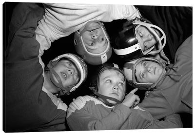 1960s Five Boys In Huddle Wearing Helmets & Football Jerseys The View Is From Inside The Huddle Looking Up Canvas Art Print - Teamwork Art