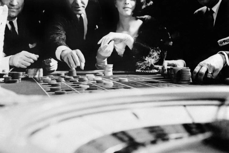 1960s Four Anonymous Unidentified People Gambling Casino Roulette