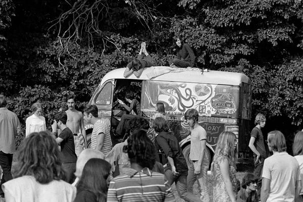 1960s Gathering Of Hippie Kids In Woods With Psychedelic Painted Van In Background