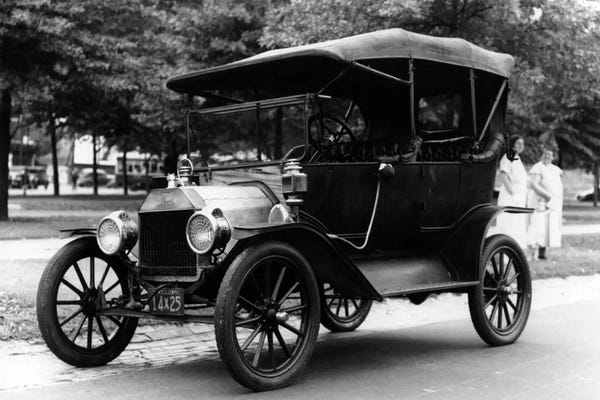 Vintage & Retro Photography: 1920s Model T Ford Touring Car Automobile On Display During Parade by Vintage Images