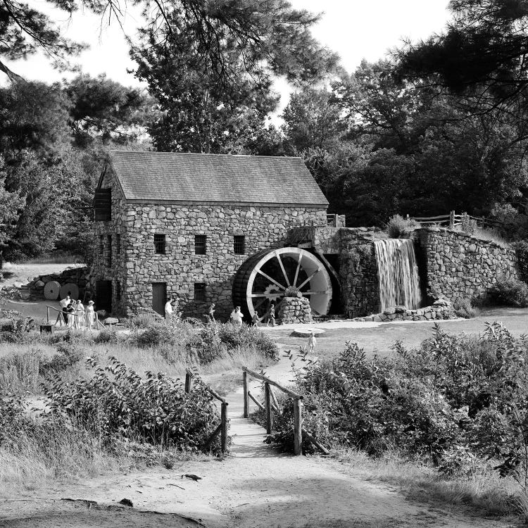 1960s People Tourists Visiting Rustic Grist Mill With Stone Structure Waterfall And Waterwheel Sudbury Massachusetts USA