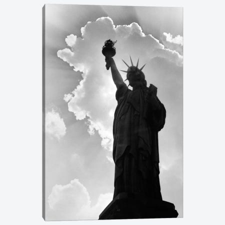 1960s Silhouette Of Statue Of Liberty With Sun Ray Clouds Behind Canvas Print #VTG458} by Vintage Images Art Print
