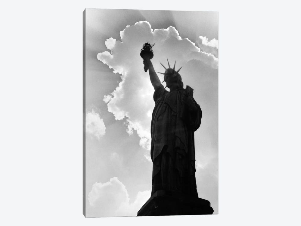 1960s Silhouette Of Statue Of Liberty With Sun Ray Clouds Behind by Vintage Images 1-piece Canvas Wall Art