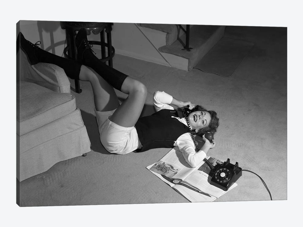 1960s Teenage Girl Lying On Floor Wear Shorts Knee Socks Reading Magazine Talking On Telephone Looking At Camera by Vintage Images 1-piece Canvas Art Print