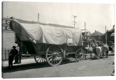 1920s Ox Drawn Conestoga Covered Wagon Parked Along Street Canvas Art Print - Carriage & Wagon Art