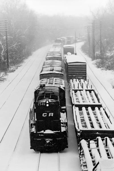 Trains: 1970s Pair Of Freight Trains Traveling On Snow Covered Railroad Tracks by Vintage Images