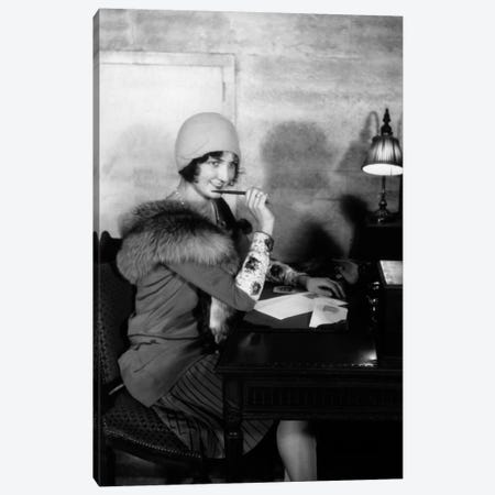 1920s Smiling Woman With Pen To Lips Wearing Cloche Hat And Fur Collar Coat Writing A Letter At Hotel Lobby Desk With Lamp Canvas Print #VTG49} by Vintage Images Canvas Wall Art