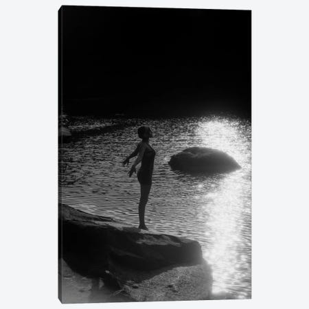 1920s Sunset Silhouette Of Anonymous Woman Standing On A Rock Near Water About To Dive In Canvas Print #VTG50} by Vintage Images Art Print