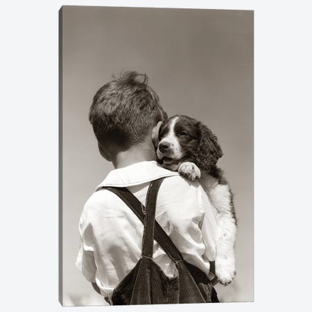 1930s-40s Back View Of Boy In Corduroy Overalls Holding Springer Spaniel Puppy Canvas Print #VTG546} by Vintage Images Canvas Wall Art