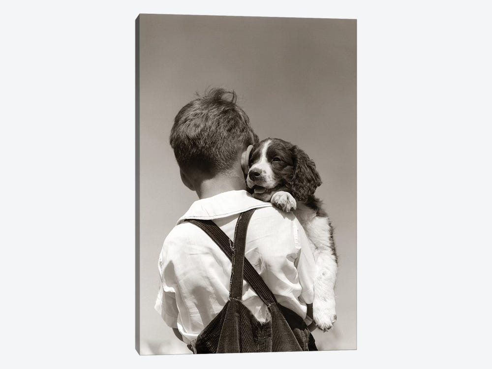 1930s-40s Back View Of Boy In Corduroy Overalls Holding Springer Spaniel Puppy by Vintage Images 1-piece Canvas Artwork