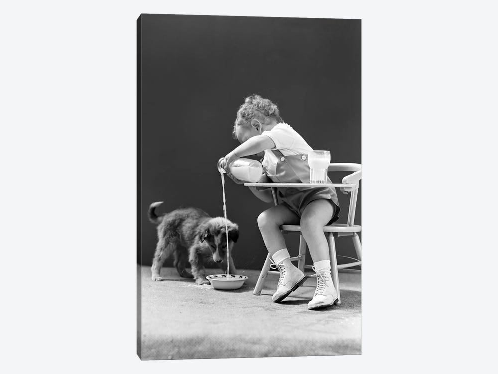 1940s Toddler Sitting In Chair Pouring Milk From Bottle Into Bowl For Puppy Dog by Vintage Images 1-piece Canvas Wall Art