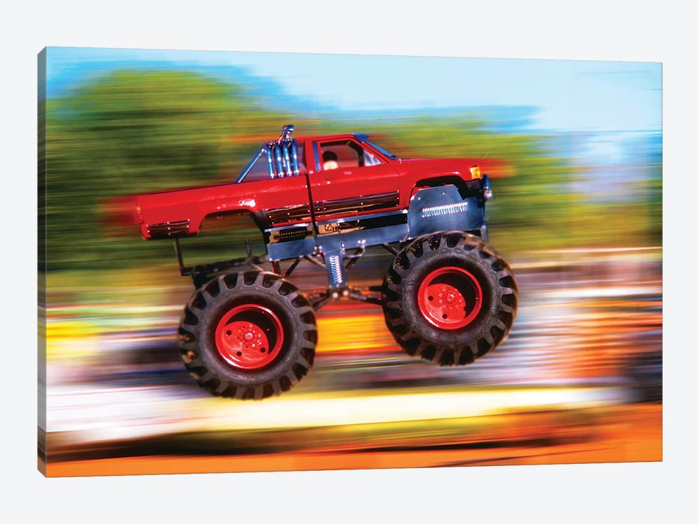 Big Wheeled Red Truck Jumping Blurred Background 1-piece Art Print