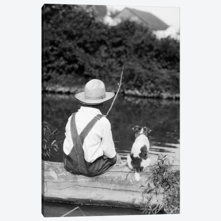 1920s-1930s Farm Boy Wearing Straw Hat And Overalls Sitting On Log With Spotted Dog Fishing In Pond Canvas Print #VTG63} by Vintage Images Canvas Artwork
