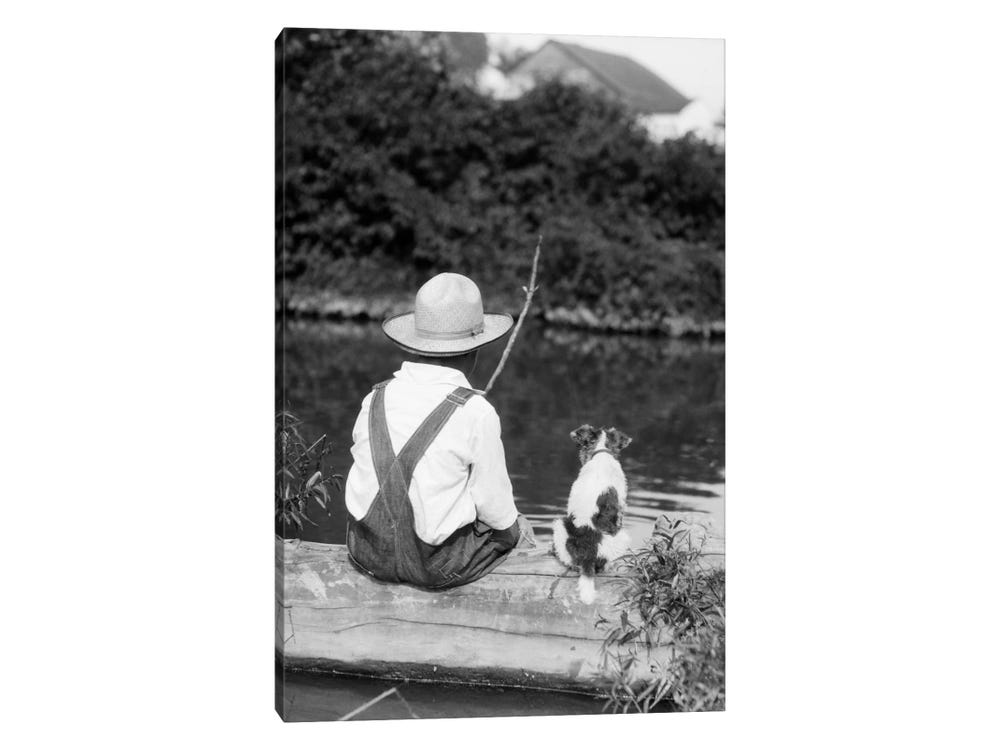 Framed Canvas Art - 1920s-1930s Farm Boy Wearing Straw Hat and Overalls Sitting On Log with Spotted Dog Fishing in Pond by Vintage Images ( Animals >