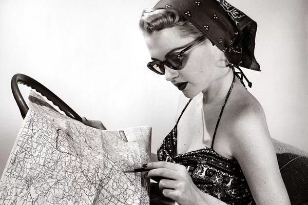 Eyewear: 1950s Woman Wearing Bandana Sunglasses & Halter Top Marking Road Map by Vintage Images